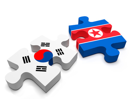 North Korea - South Korea -  2 jigsaw puzzle pieces, 1 containing the flag of North Korea, the other of South Korea. Isolated on a white background.の写真素材