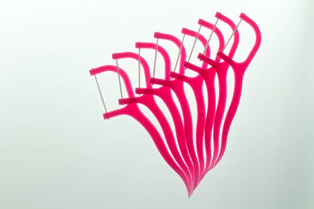 Floss Toothpick on white backgroundの写真素材