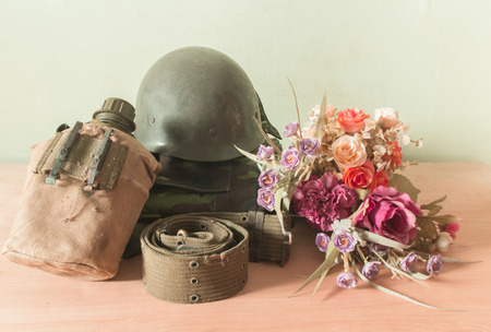 Still life  photography on vintage army helmet and flowerの写真素材