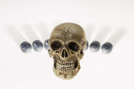 Human skull and Medical equipment on white backgroundの写真素材