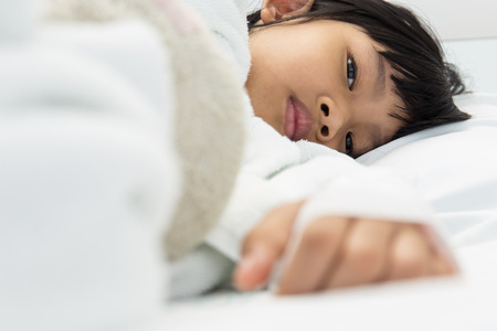 The eyes of a girl lying on a hospital bed,dept of fieldの写真素材