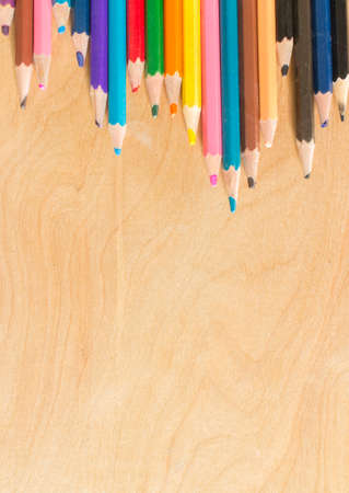 Colored pencils reverseMany different colored pencils on wood backgroundの写真素材