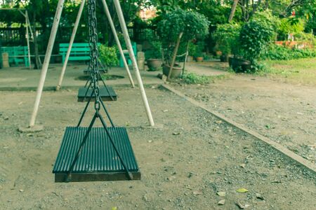 Playground swing in a parkの写真素材