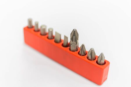 Clpse up screwdriver and set bit on white background