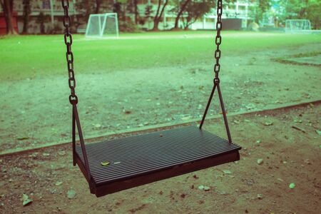 Playground swing in a parkの写真素材