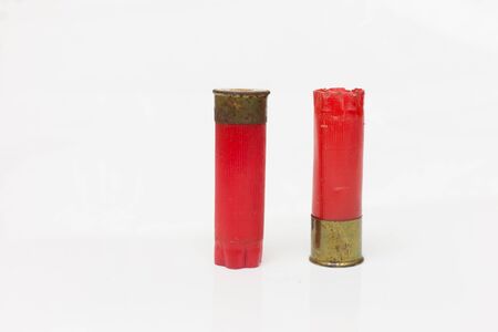 Red shotgun shell used.On white background.の写真素材