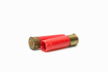 Red shotgun shell used.On white background.の写真素材