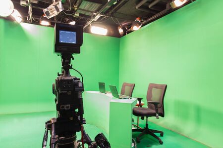 Television studio with camera and lights - camera on tripodの写真素材