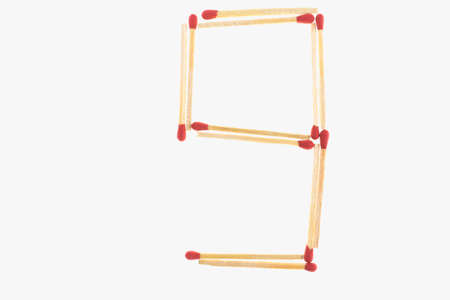 letter 9 made of safety match isolated on white backgroundの写真素材