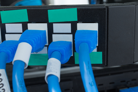 Network switch HUB and ethernet cables (LAN) in data center.