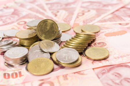 Images of banknotes and coins of 100 baht in Thailand .の写真素材