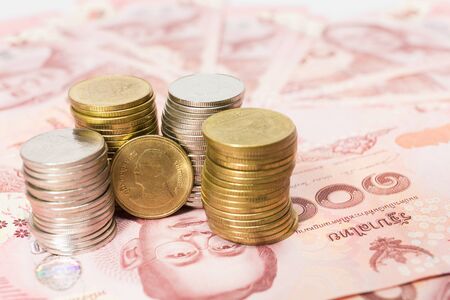 Images of banknotes and coins of 100 baht in Thailand .の写真素材