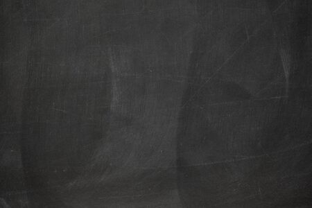Texture of chalk rubbed out on blackboard or chalkboard background. School education, dark wall backdrop or learning concept.の写真素材