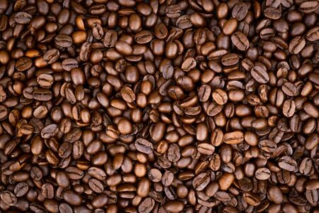 Top view of brown roasted coffee beans, can be use as background, copy space for text.の写真素材