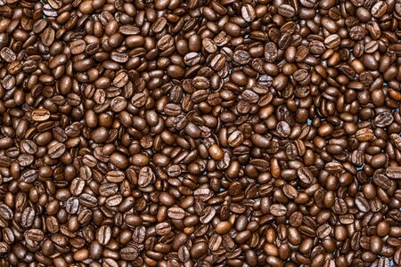 Top view of brown roasted coffee beans, can be use as background, copy space for text.の写真素材