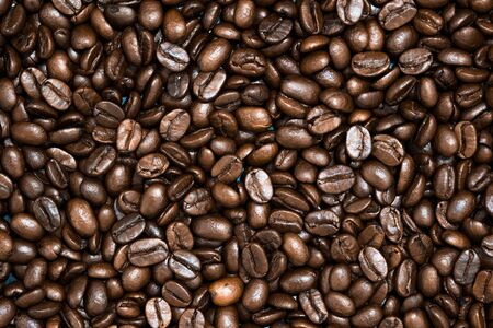 Top view of brown roasted coffee beans, can be use as background, copy space for text.の写真素材