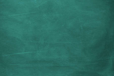 Texture of chalk rubbed out on blackboard or chalkboard background. School education, dark wall backdrop or learning concept.の写真素材