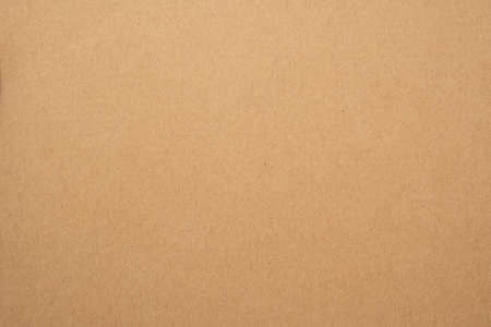 Texture of brown craft or kraft paper background, cardboard sheet, recycle paper, copy space for text.の写真素材