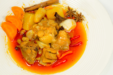 Spicy Muslim chicken curry on white backgroundの写真素材