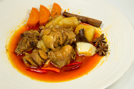 Spicy Muslim chicken curry on white backgroundの写真素材