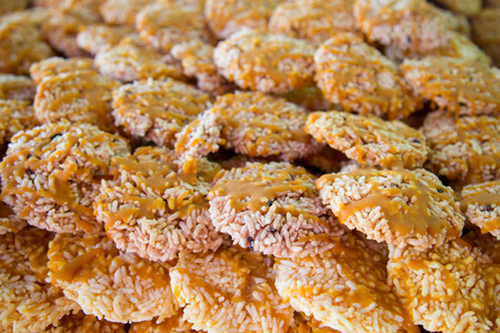 Khaotan Rice  thai name  Cracker, sweetmeat made of steamed sticky rice, fried in oil, painted with a candy cane is a traditional heart of northern Thailand の写真素材