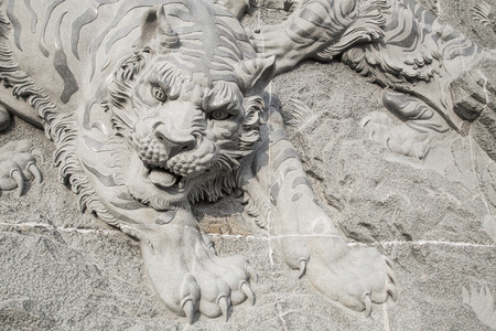 tiger on chinese temple wall by stone carving