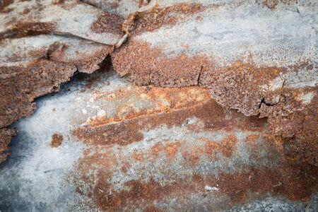 Tear of old tin and rust background 