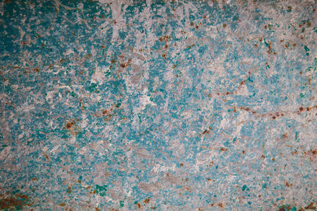 Texture of rusty metal with traces of green and cement の写真素材