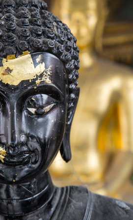 Close Up half face of a buddha at the temple in Thailandの写真素材