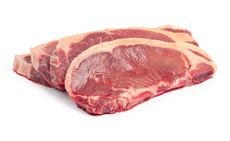 fresh raw beef steak isolated on white background with clipping path.の写真素材