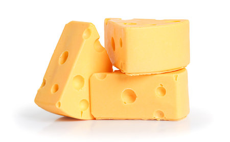 Delicious cheese pieces, isolated on white backgroundの写真素材