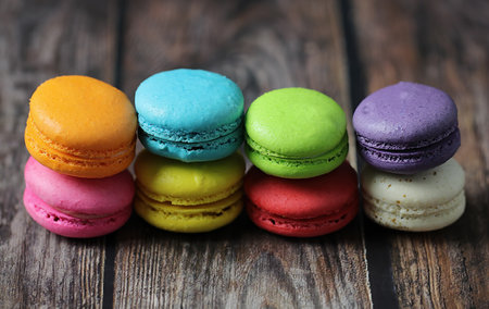 Colorful macaron cake or macaroon on wooden background, Small French cakes.の写真素材