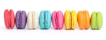 Colorful macarons cake or macaroons isolated on white backgroundの写真素材