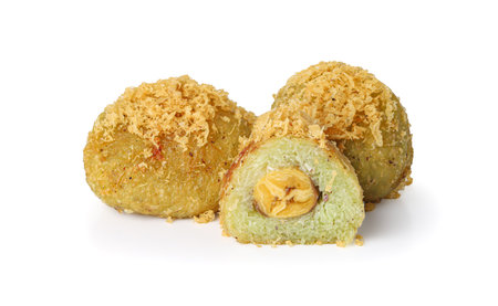 Battered and Deep-Fried Unripe Rice and Grated Coconut Banana Rolls (khaao mao thaawt), Thai sweet dessert isolated on white backgroundの写真素材