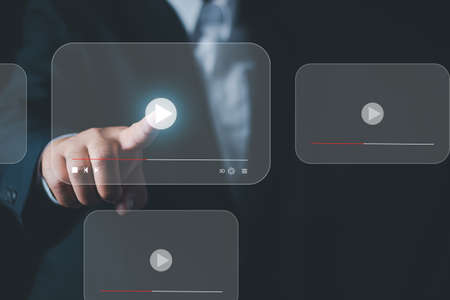 Businessman pressing play button to start or initiate projects, hand press play button sign to start or initiate projects as con, Online live streaming video marketing concept.の写真素材