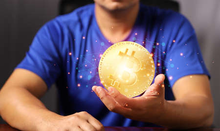 Blockchain technology and network concept. Man holding bitcoin hand with icons network connection on...