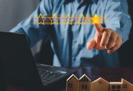 Customer satisfaction concept. hand put the stars to complete five stars. Giving a five star rating....