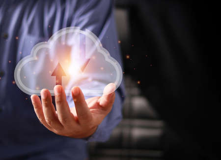Hand touching to virtual artificial intelligence with cloud technology transformation and internet of thing, Cloud Computing Technology Internet Storage Network Concept.の写真素材