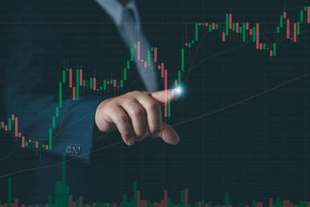 Businessman or trader touch virtual hologram stock , planning and strategy, Stock market, Business...