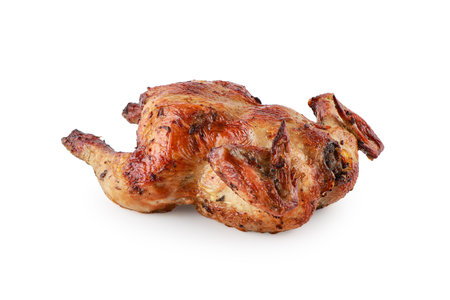 Grilled chicken delicious ready to eat served on a aluminium foil isolated on white background with clipping path, Baked whole chicken, fried chicken in any kitchen, Chick meat prepared at grill.の写真素材