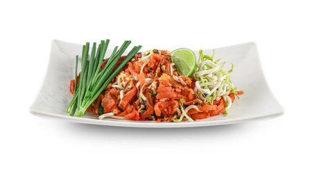 Pad Thai popular street food, shrimp pad thai isolated on the white background with clipping path, thai food, thai style decoration, Original thai food on a dark background and copy space.の写真素材