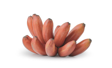 red bananas on a white background. The bananas are arranged in a cluster and are a bright red color. The bananas are ripe and ready to eat.の写真素材
