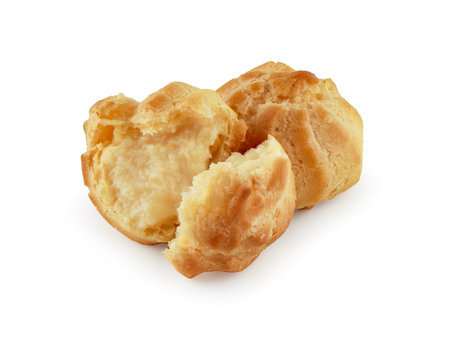 Choux Cream isolated on white background with clipping path, Profiterole, Eclair, Puff pastry ball with creme anglais, Cream puffs, semla, homemade pastry, French dessert.の写真素材