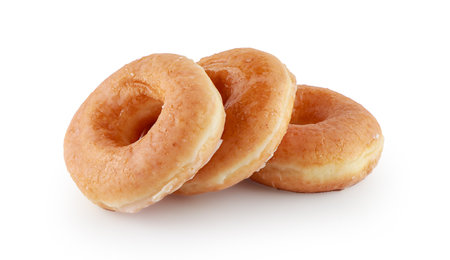 Various glazed doughnuts isolated on white background with clipping path, Plain glazed donuts, Tasty glazed donuts stacked.の写真素材