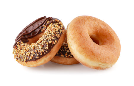 Donut or Doughnut isolated on white background with clipping path,  Three Donuts or Doughnuts with chocolate brown glazed cream or icing without sprinkles. Dessert on birthday, holiday party.の写真素材