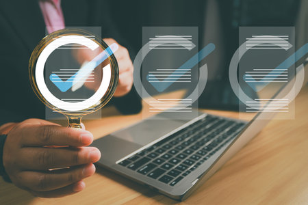 Check mark, Management approval and project approval concepts, business process approval documents, Businessman holds magnifying glass with project approval icons, approves documents to grow business.の写真素材