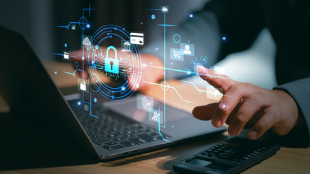 Cybersecurity protection concept with a hand touching a glowing padlock and shield icon, representing data security, encryption, and secure digital access in a high-tech environment.の写真素材
