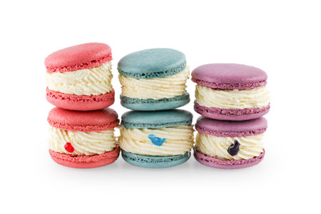 Colorful macaron cakes. Small french muffins. Colorful macarons on a white background with clipping path.の写真素材