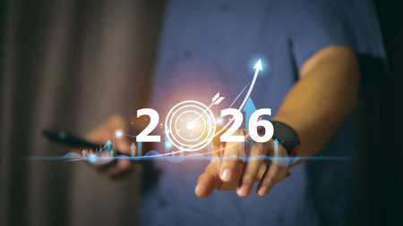 Businessman touching digital 2026 target icon with rising growth graph, symbolizing future planning,...