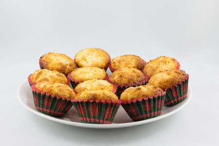 Golden Macaroons on white plateの写真素材